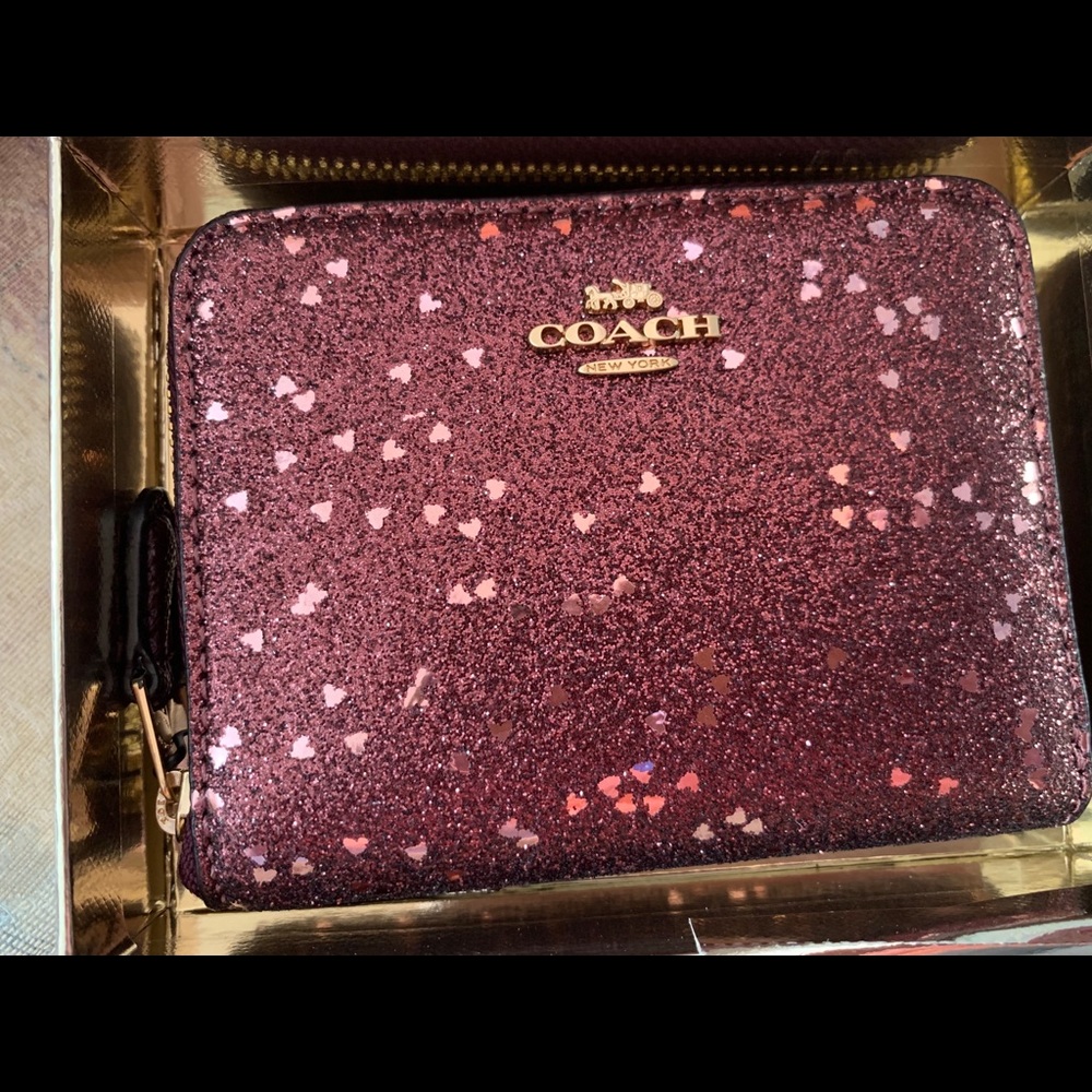 Coach small zip around wallet.